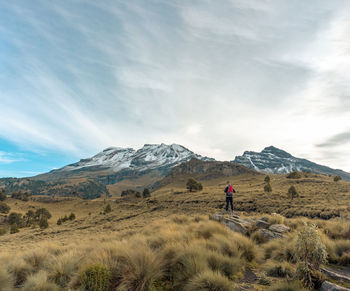 A hiker stands