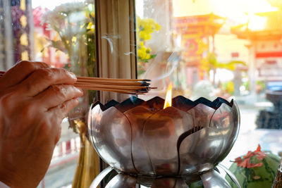 Close-up of hand holding glass