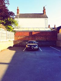 Car on building against sky