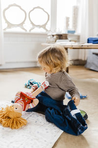 Girl playing with toys at home