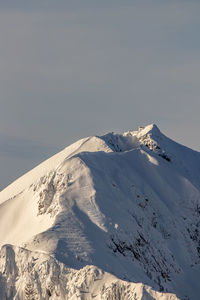 Scenic view of snowcapped mountain against sky