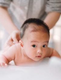 Close-up portrait of cute baby at home