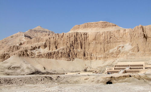 View of desert against clear blue sky