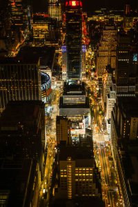 Aerial view of illuminated buildings in city at night