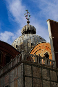 Low angle view of cathedral against cloudy sky