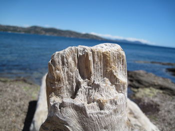 Close-up of sea against blue sky