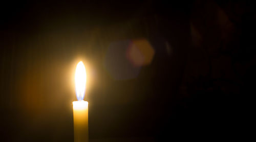 Close-up of illuminated candle