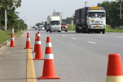 Traffic cones on road in city