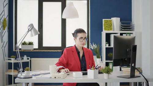 Portrait of young woman working at clinic