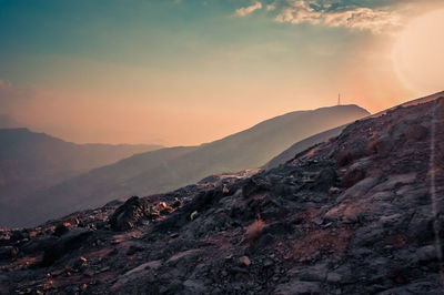 Scenic view of mountains against sky during sunset