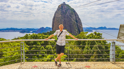 Tourist traveler poses at sugarloaf mountain rio de janeiro brazil.