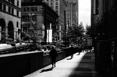 People walking on street in city
