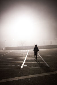 Full length of man walking on road