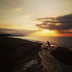 Scenic view of sea at sunset