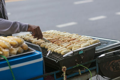 Grilled bananas are sold and prepared on the streets