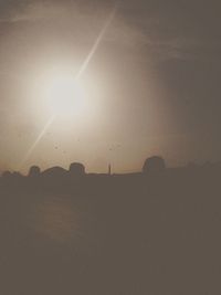 Silhouette of building at sunset