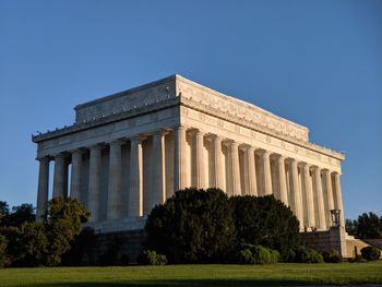 Low angle view of historical building against blue sky