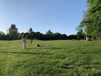 People on field against sky