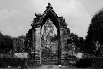 View of old building against cloudy sky