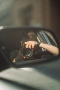 Portrait of man photographing