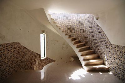 Directly below shot of spiral staircase of building