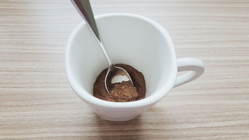 Close-up of coffee cup on table