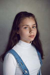 Portrait of young woman at home