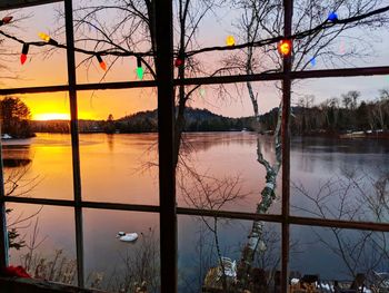 Scenic view of lake against sky during sunset