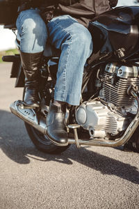 Low section of couple on motorbike