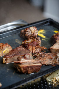 Close-up of meat on barbecue grill