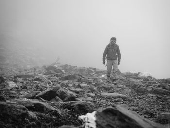 Full length of woman standing on grassy landscape