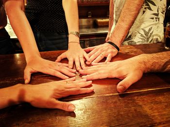 Midsection of people on table