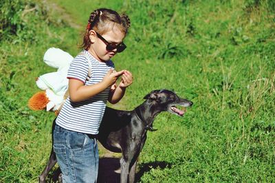 Full length of a dog on field