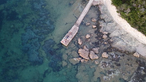 High angle view of rocks on shore