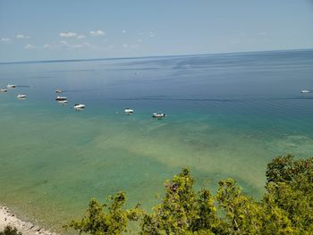 High angle view of sailboats in sea against sky