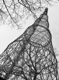 Low angle view of bare trees against sky