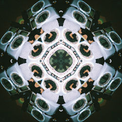 Directly below shot of illuminated lighting equipment on ceiling