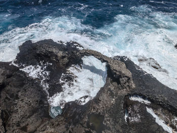 Scenic view of sea against mountain