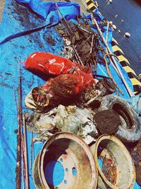 High angle view of garbage on blue table