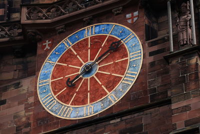 Low angle view of clock on building
