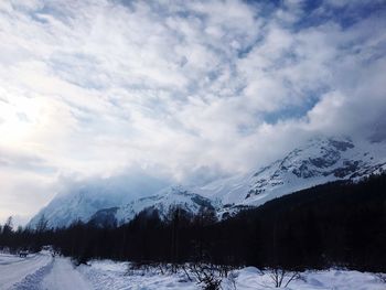 Scenic view of snowcapped mountains against sky