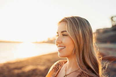 Portrait of young woman looking away