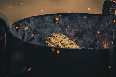 Close-up of corn cobs on barbecue grill