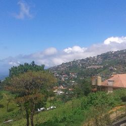 Scenic view of mountains against blue sky