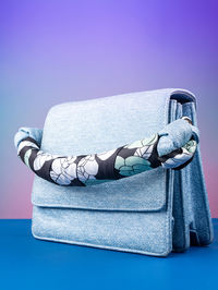 Close-up of bag against blue background