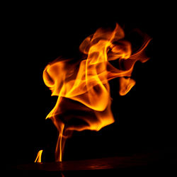 Close-up of bonfire against black background