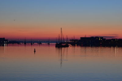 Silhouette of marina at sunset