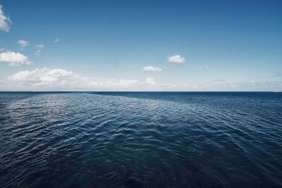 Scenic view of sea against blue sky