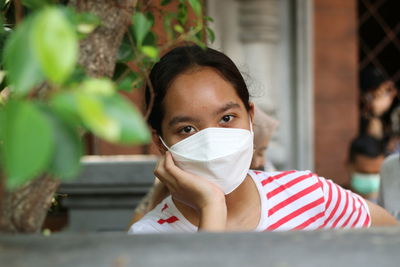 Young girls with mask to protect her from corona virus