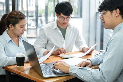 Business colleagues working at office